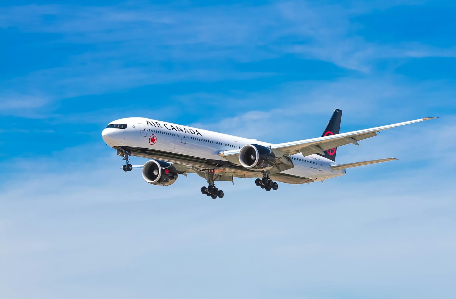 Passenger jet approaching an airport in a clear sky