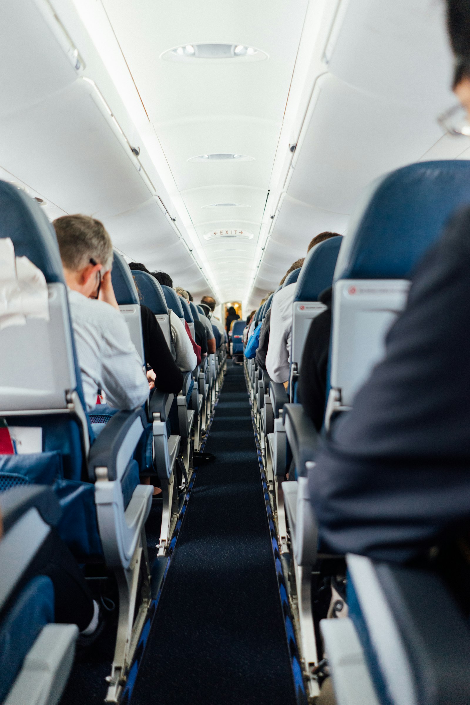 Aircraft cabin with rows of passenger seats